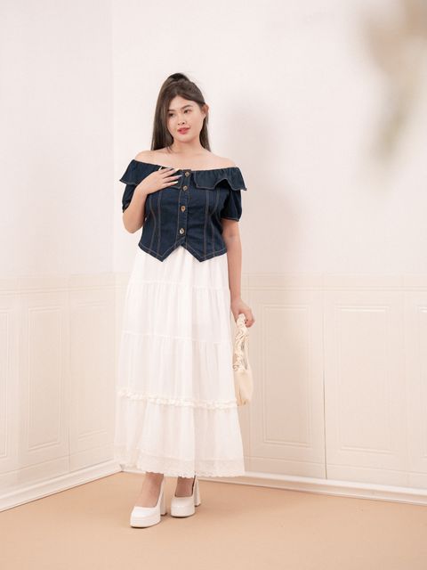Denim off-shoulder top paired with a tiered white skirt for a romantic look.