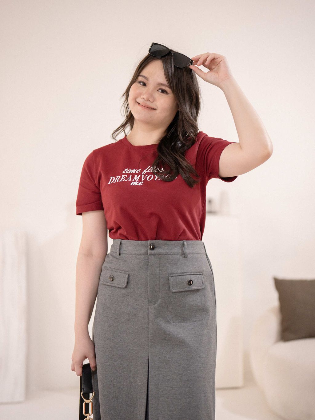Close-up of red Dream Voyage Tee showing bold white text graphic across the chest.