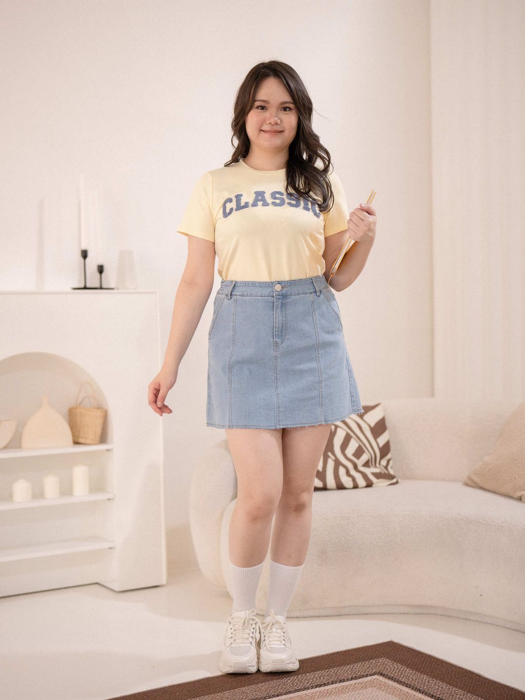 Yellow textured Classic tee paired with denim skirt – youthful plus-size style.