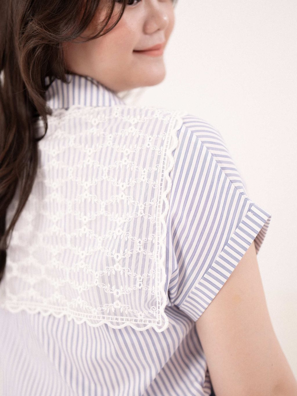 Back view of the Lace Sailor Stripe Shirt showing sheer floral lace panel over striped fabric.