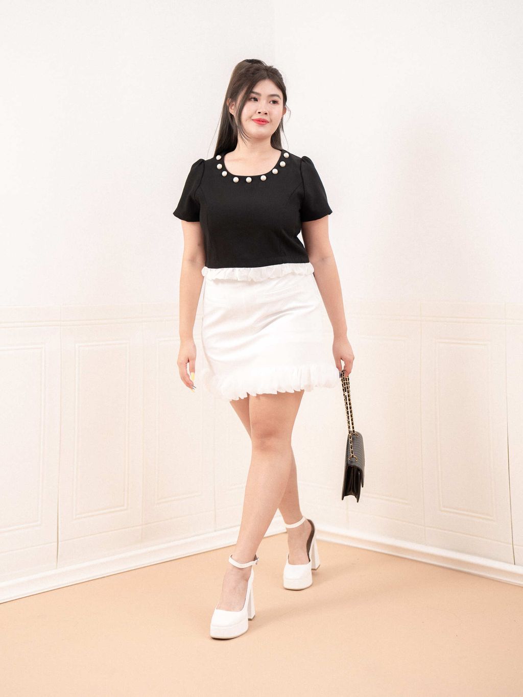 Plus size white mini skirt with soft ruffle trim