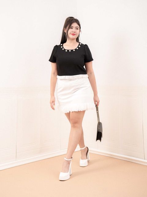 Plus size white mini skirt with soft ruffle trim