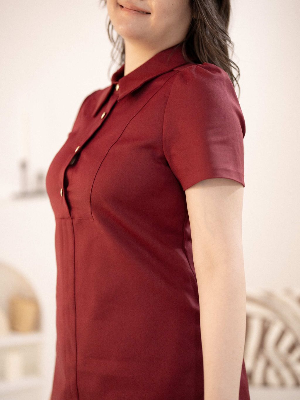 Side angle of plus-size structured dress highlighting waistline design