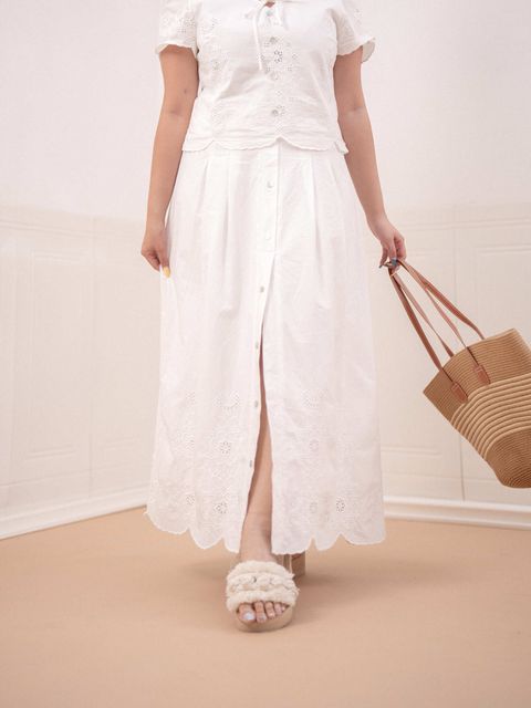 Button-down detail and front slit on white embroidered skirt