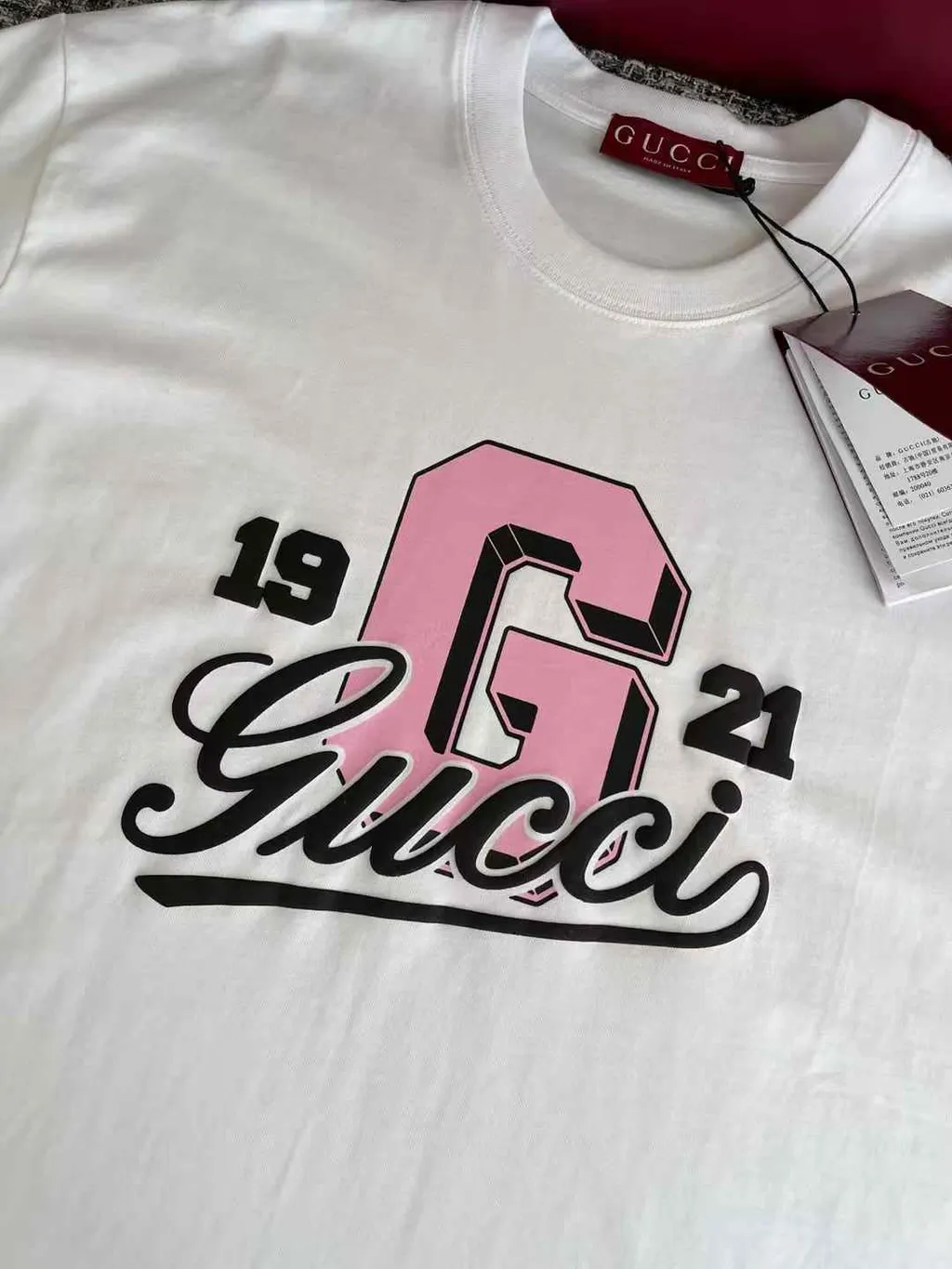GUCCI 1921粉色字母草寫字體短袖上衣  12.08.35