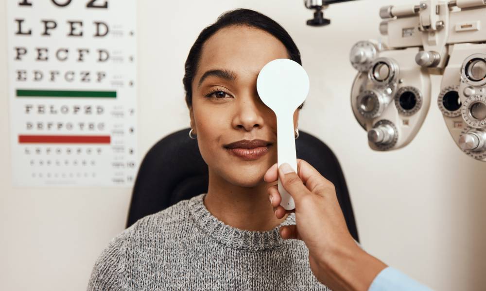 shot-of-an-optometrist-covering-her-patients-eyes-2023-11-27-04-58-35-utc-1