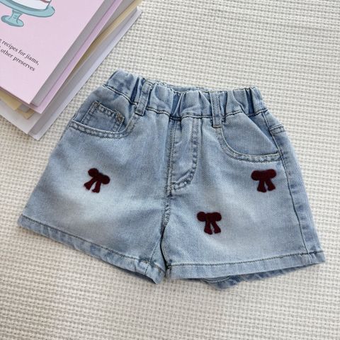絲絨蝴蝶結裝飾牛仔褲