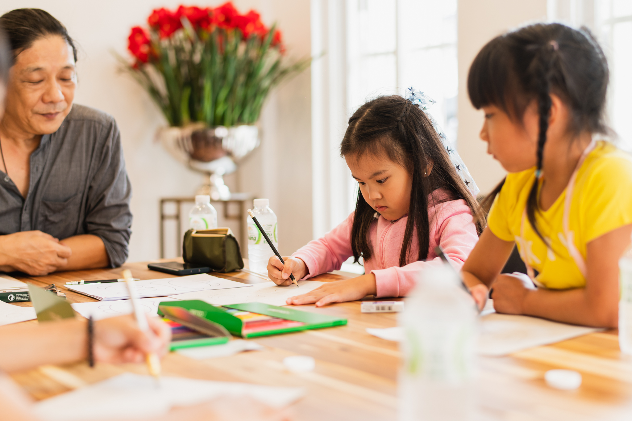 Art teacher guiding child