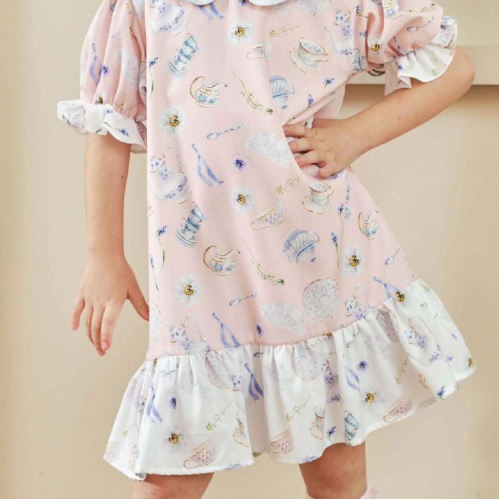 Introducing our new Wonderland Collection, featuring signature bow dresses, puffy sleeves dresses, and ruffle dresses as key designs for Kinn’s.   The combination of pink, purple, black, and white creates a whim (1)