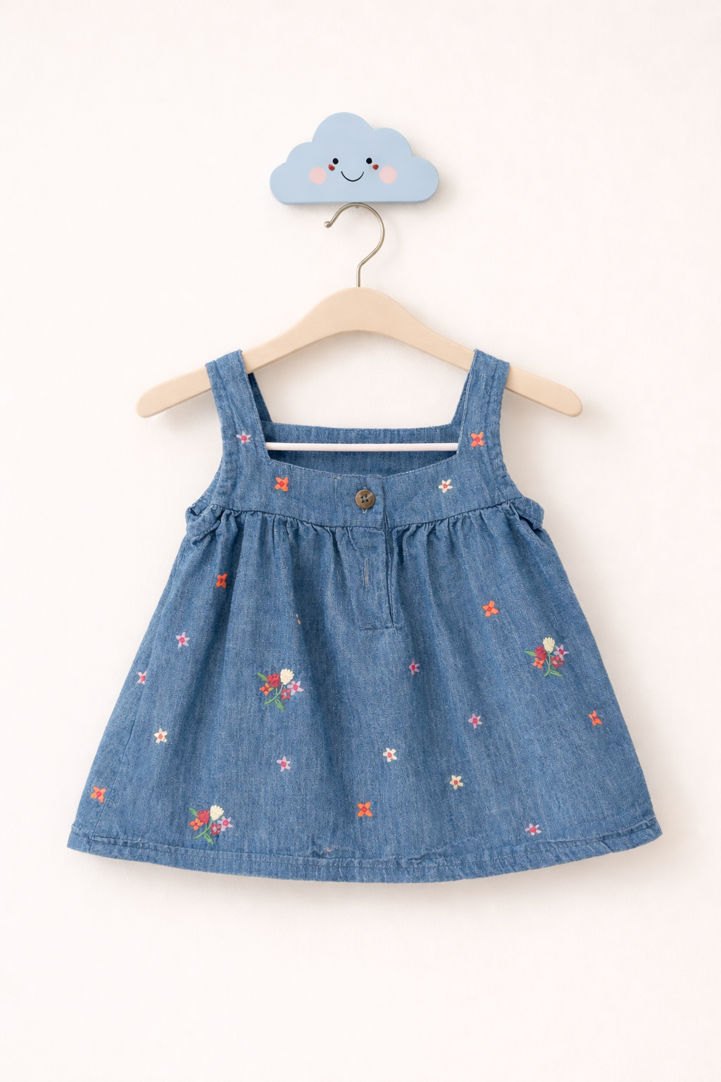 Toddler's denim sundress on hook