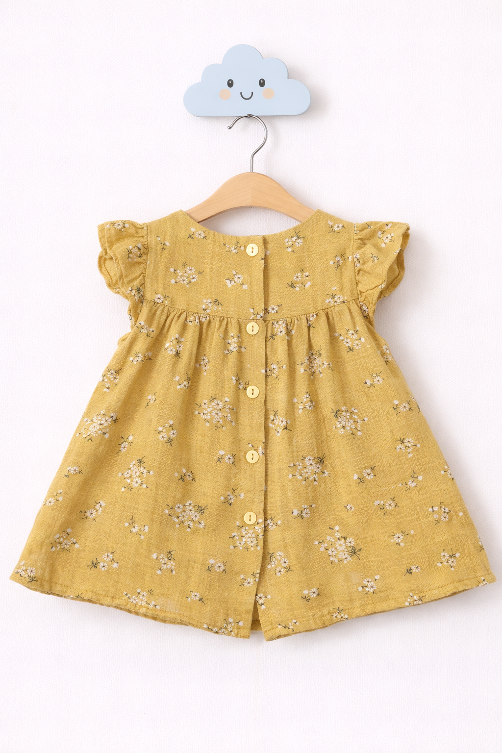 Mustard yellow dress on cloud hook