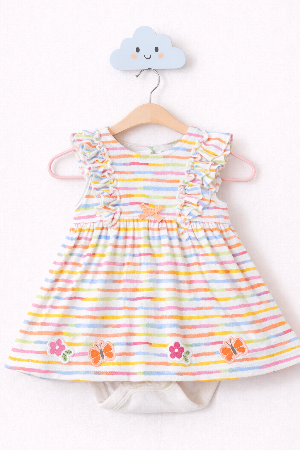 Pastel baby dress on cloud hook