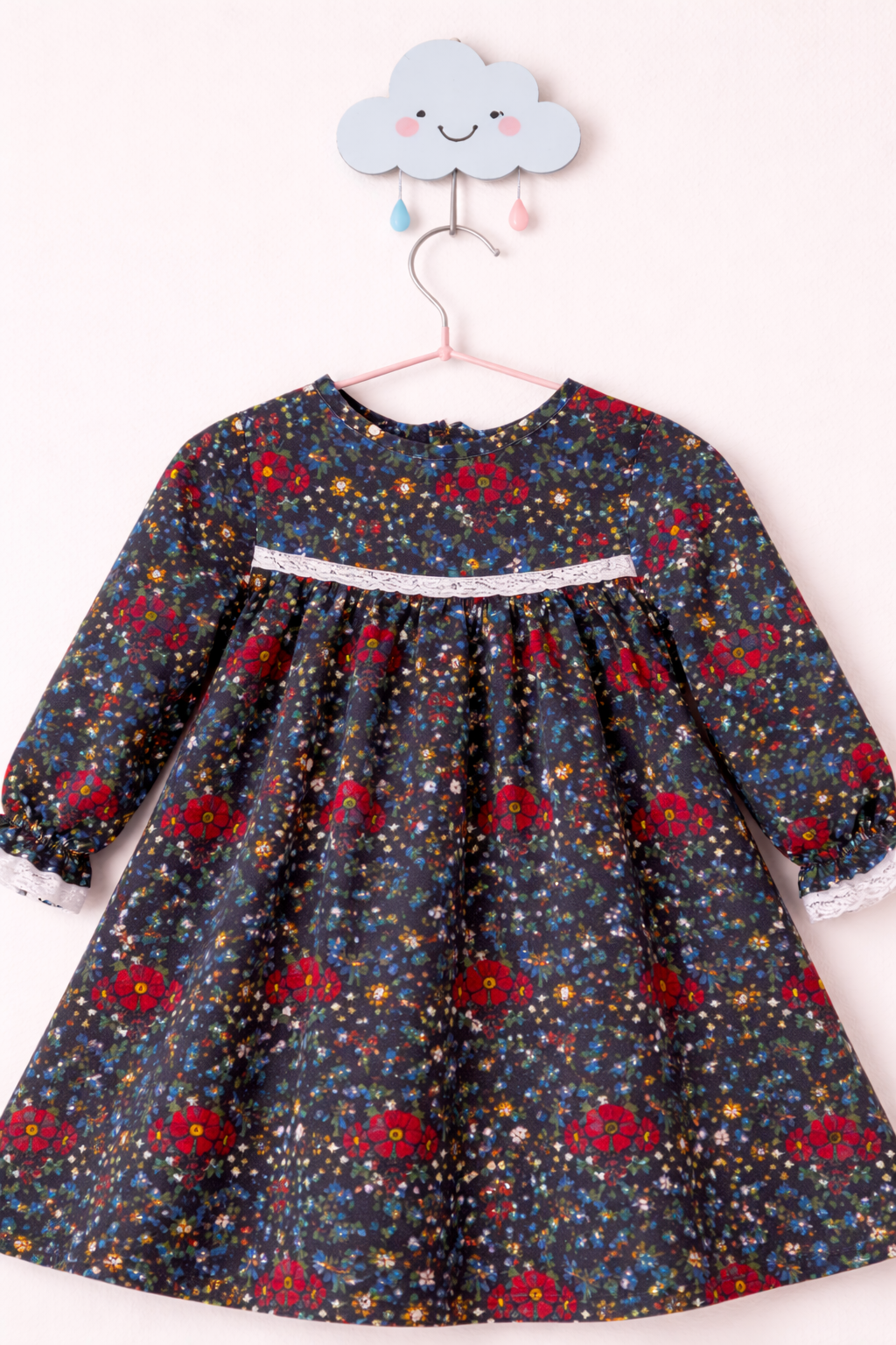 Lace-trimmed dress on cloud hook