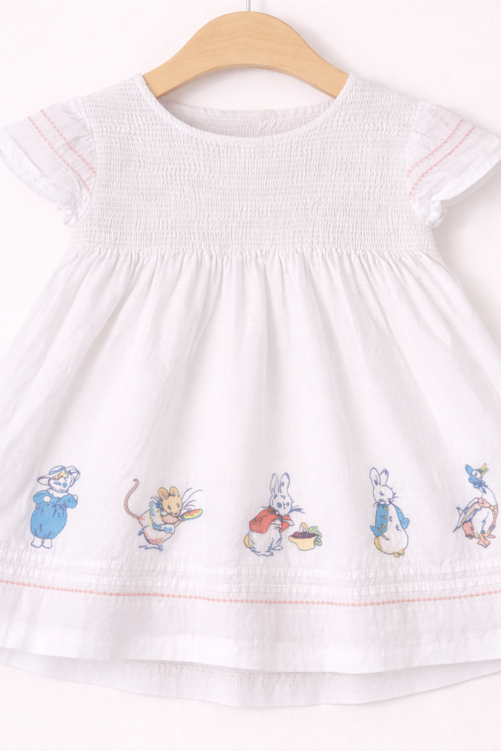 Delicate dress with Beatrix Potter embroidery