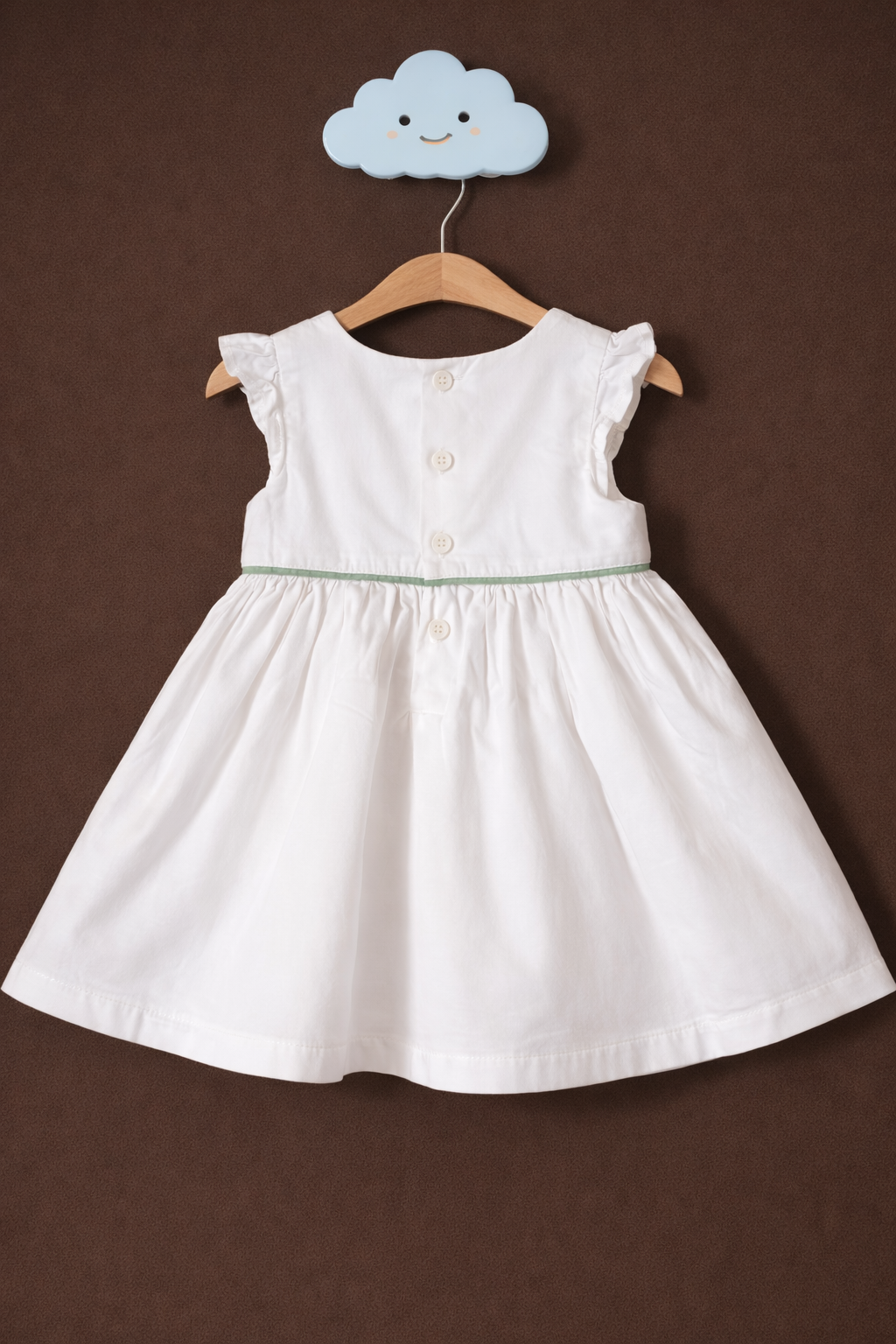 White dress on cloud-shaped hook