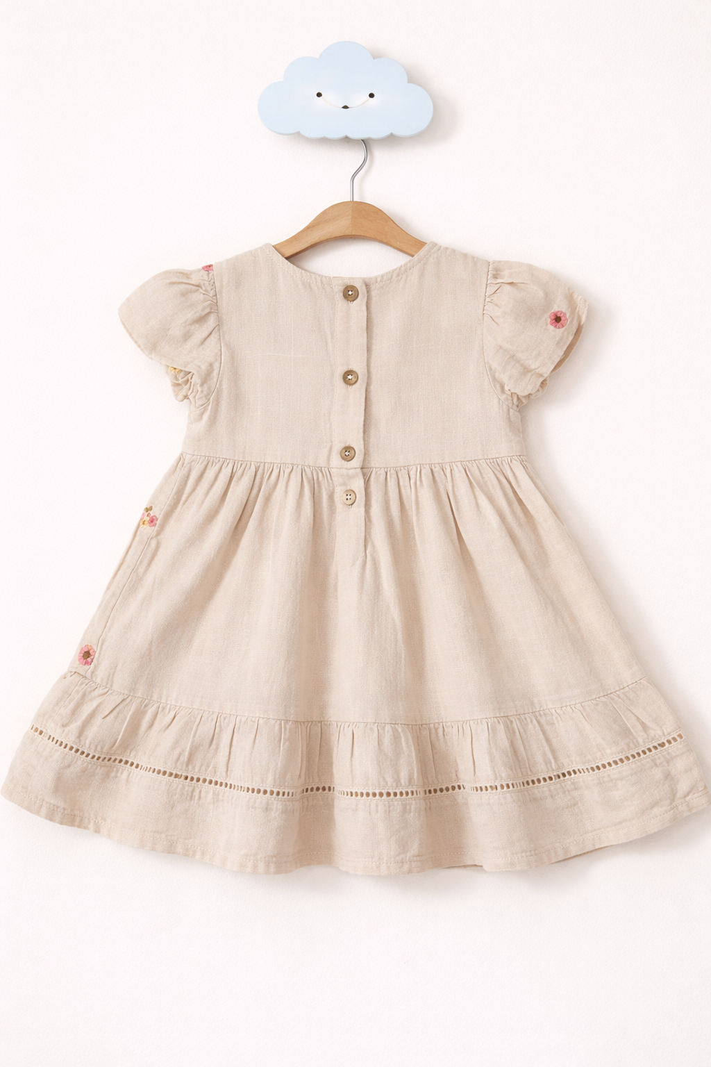 Beige linen dress on cloud hook