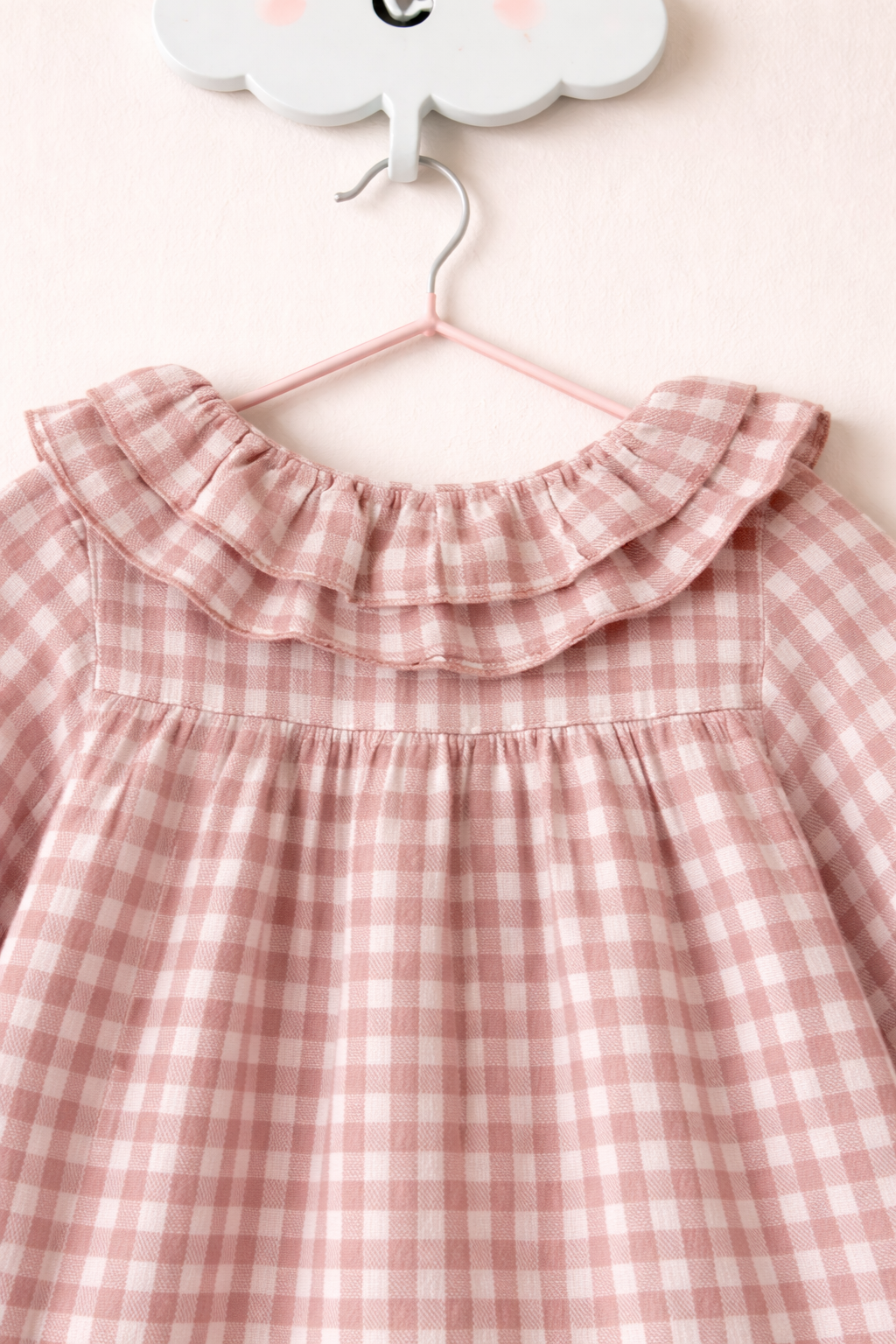 Delicate gingham blouse on cloud hook