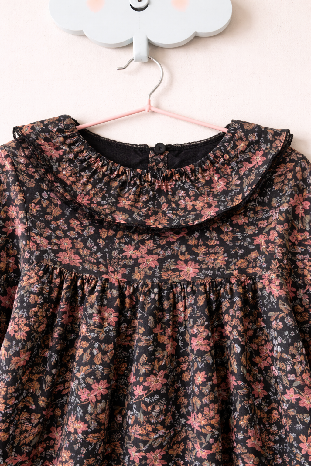 Floral dress on cloud-shaped hook