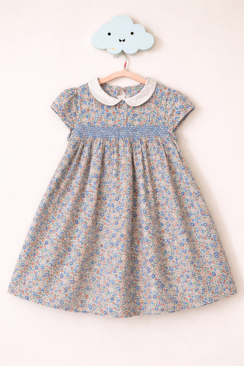 Floral smocked dress on cloud hook