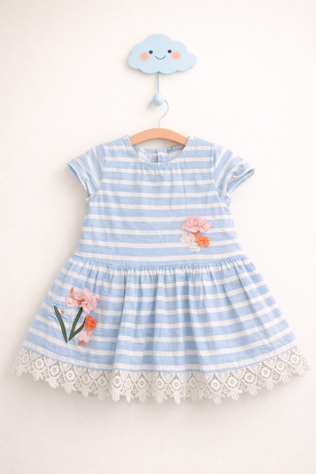 Striped dress with floral appliqués