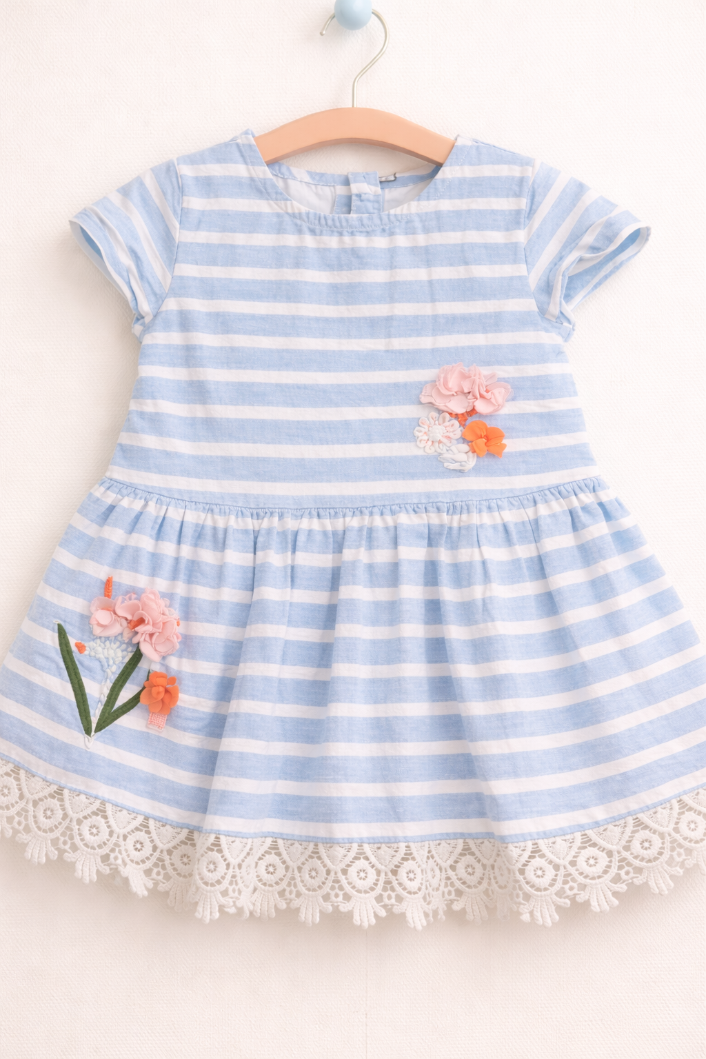 Pastel dress with floral details