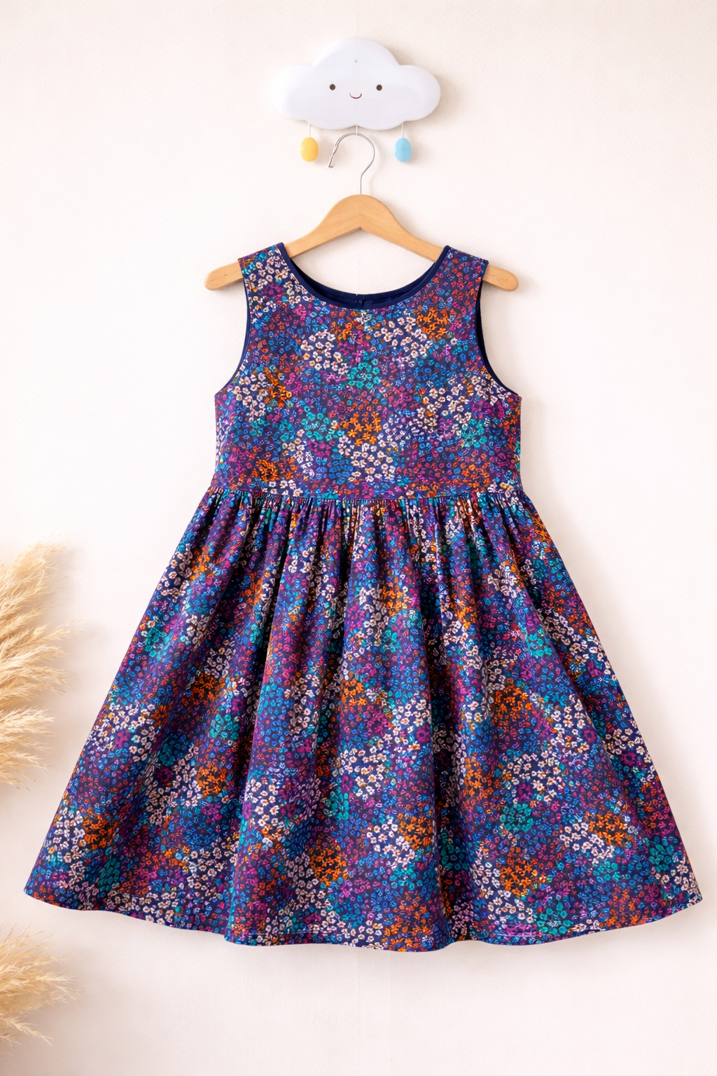 Colourful floral sundress on wall hook