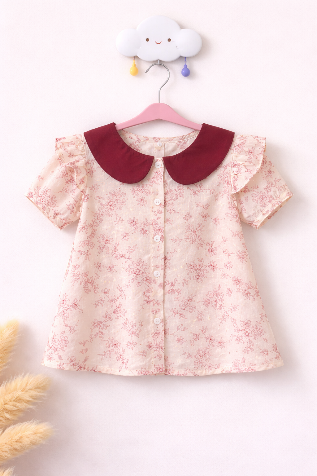 Delicate floral blouse on cloud hook