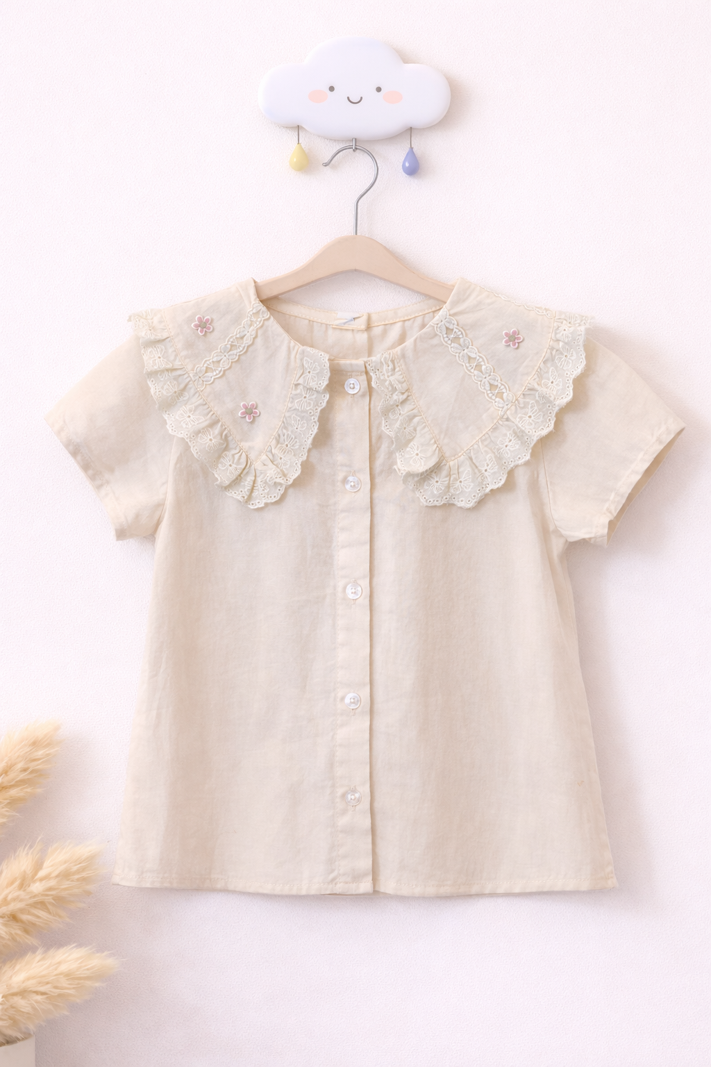 Cream blouse on playful cloud hook