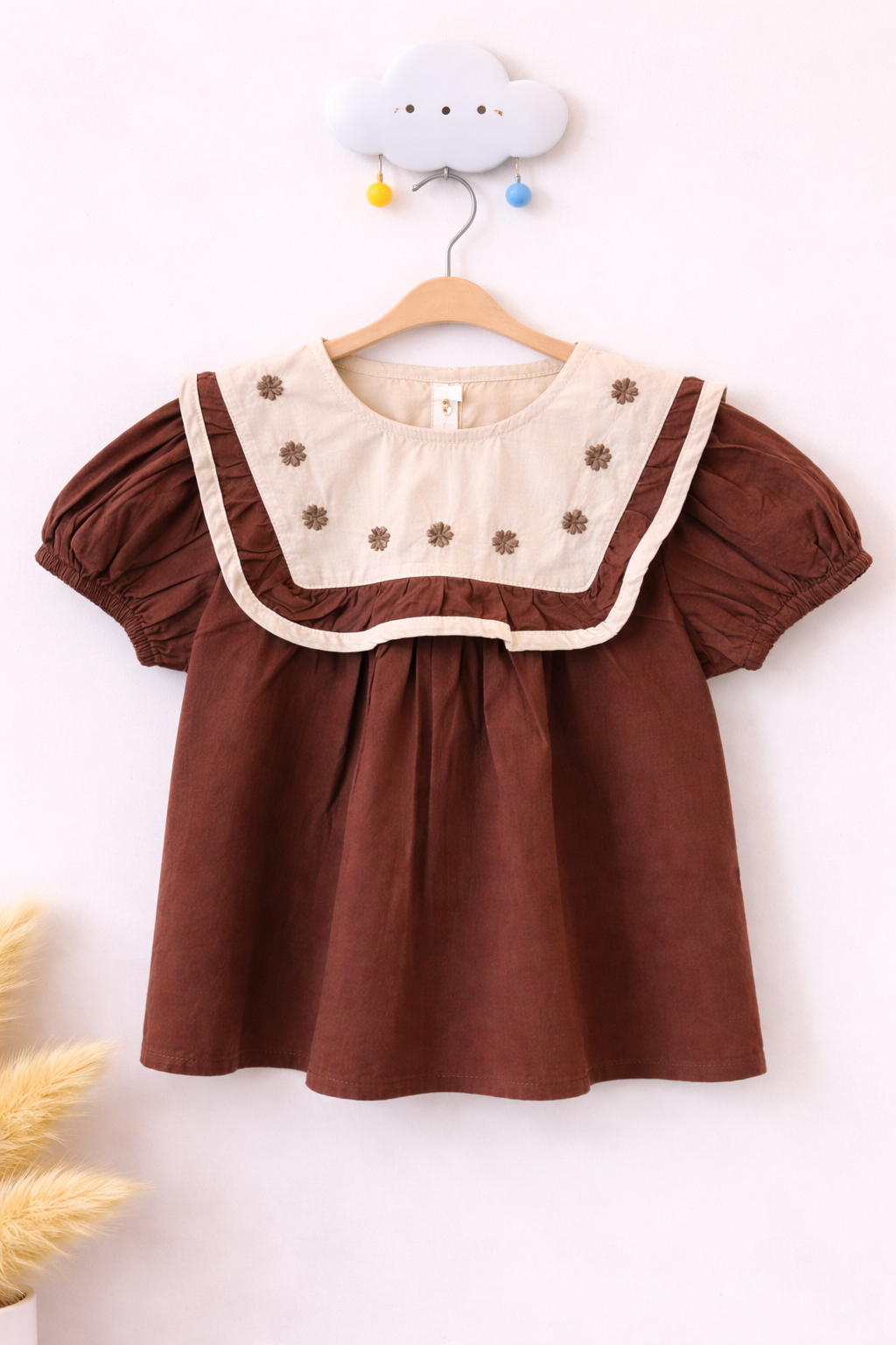 Delicate blouse on cloud-shaped hook (1)