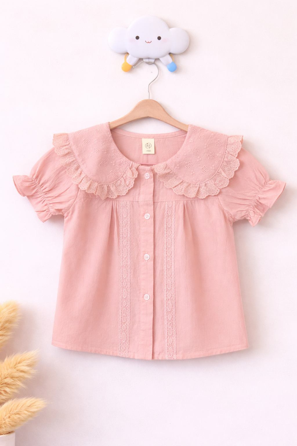 Pastel pink blouse on cloud hook