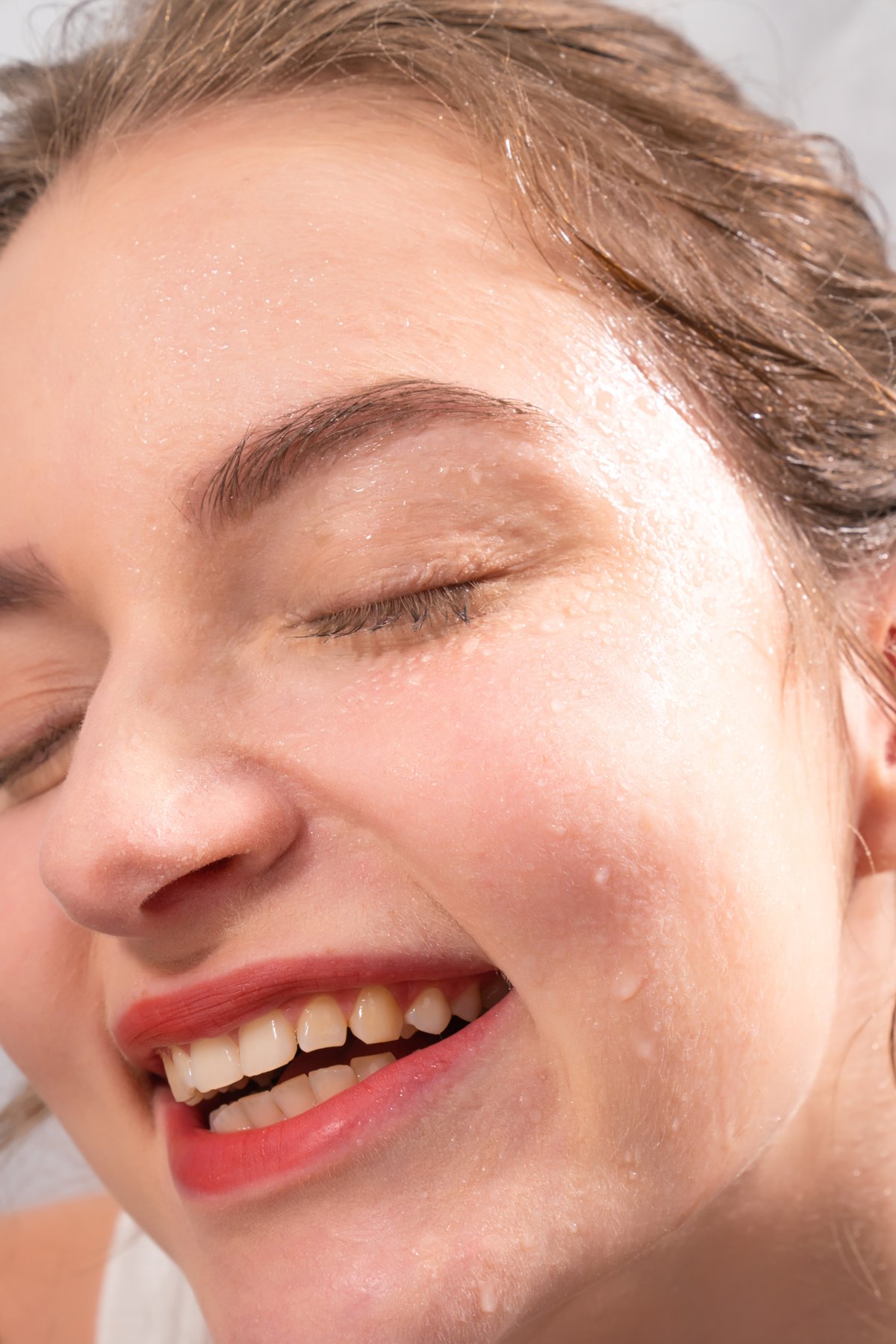 Model with dewy, freshly misted skin