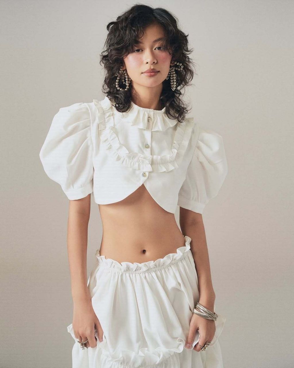 Lullaby Top- features a unique cropped silhouette with a playful tie-front detail, adding a yout