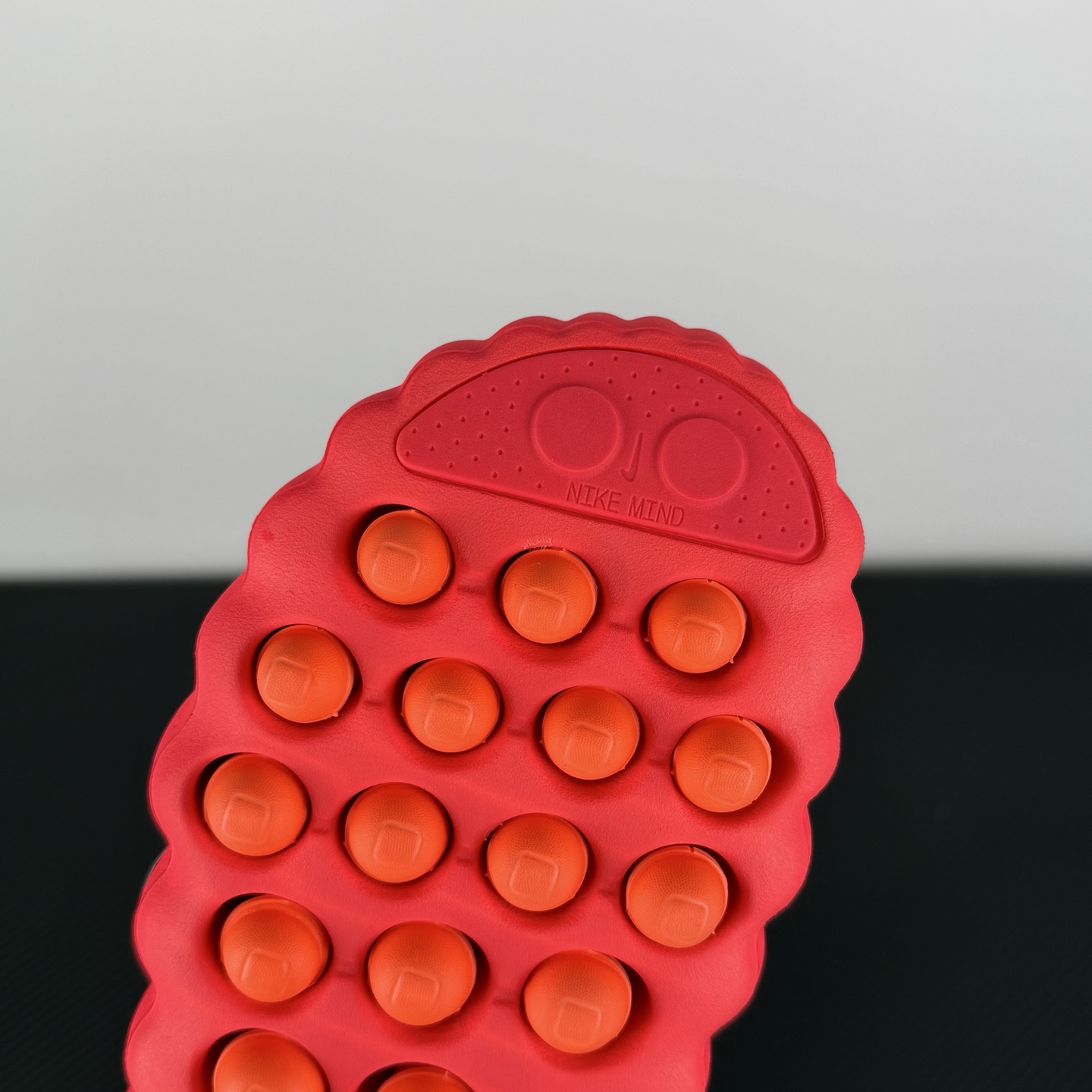 nike-mind-001-solar-red-hq4307-600-on-hand.jpg