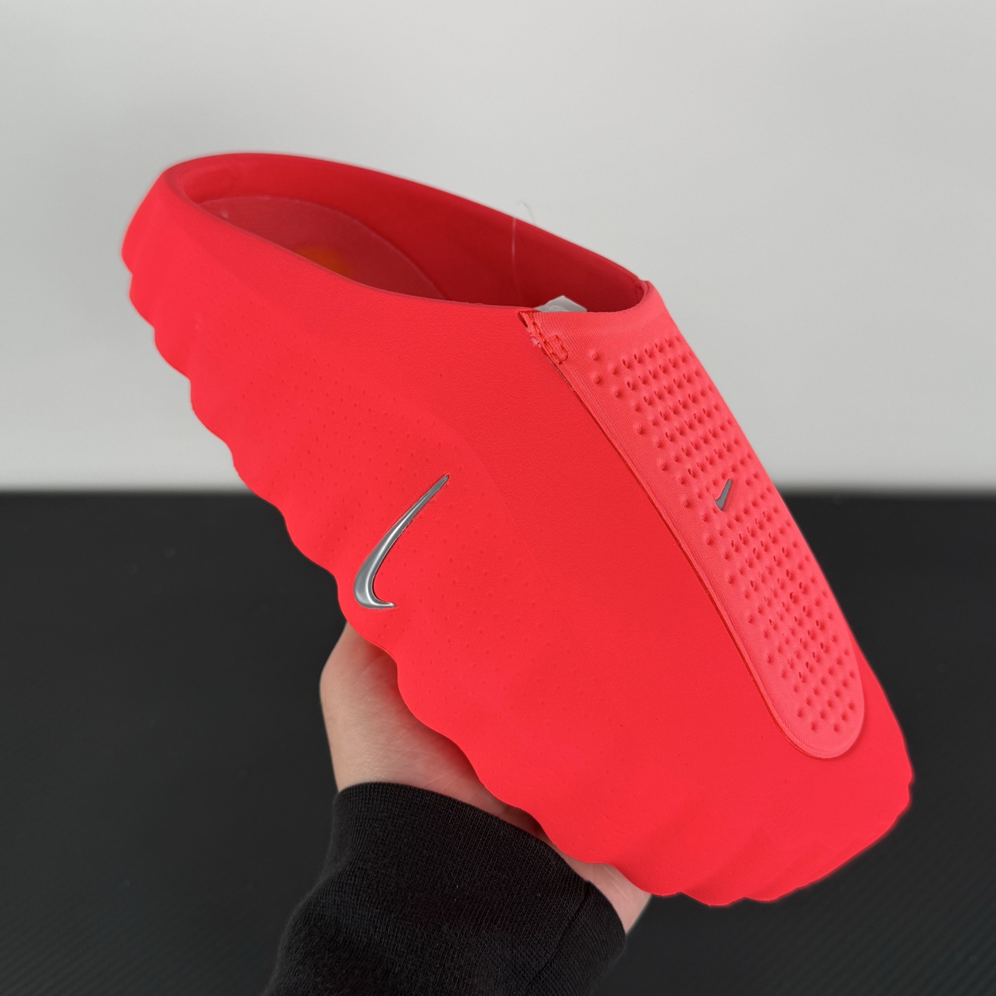 nike-mind-001-solar-red-hq4307-600-on-hand.jpg