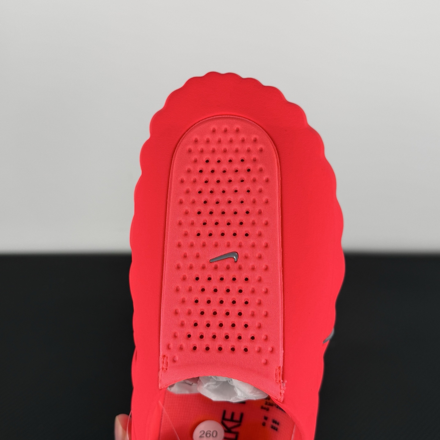 nike-mind-001-solar-red-hq4307-600-on-hand.jpg