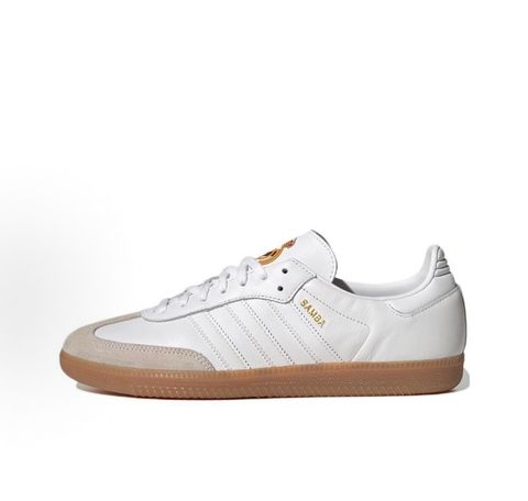 Side profile of authentic adidas Samba Team Real Madrid sneaker HQ7032, featuring crisp white leather, grey suede T-toe, gum rubber sole, and printed club crest on the tongue. Available in Singapore and Malaysia..pic_hd