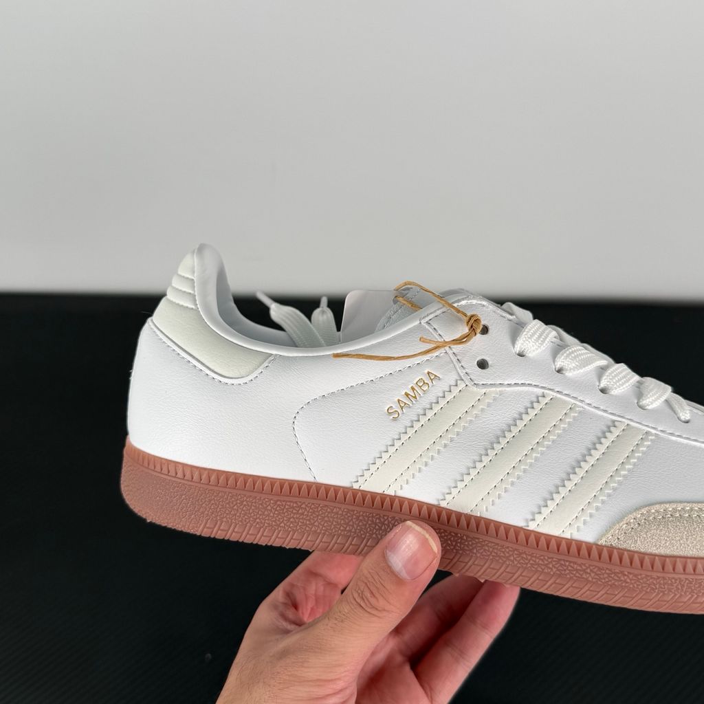 Side profile of authentic adidas Samba Team Real Madrid sneaker HQ7032, featuring crisp white leather, grey suede T-toe, gum rubber sole, and printed club crest on the tongue. Available in Singapore and Malaysia..jpg
