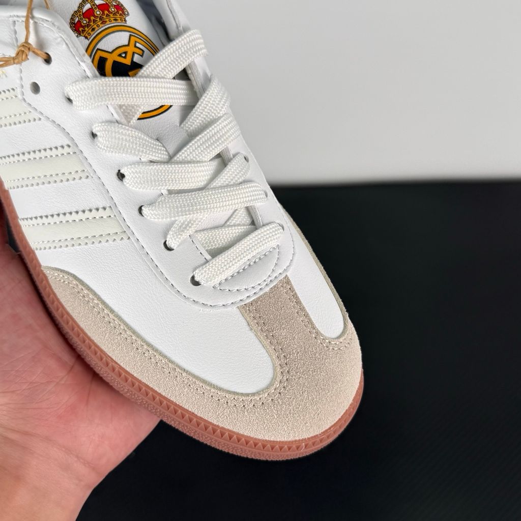 Side profile of authentic adidas Samba Team Real Madrid sneaker HQ7032, featuring crisp white leather, grey suede T-toe, gum rubber sole, and printed club crest on the tongue. Available in Singapore and Malaysia..jpg