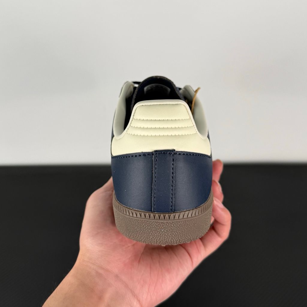 Side profile of adidas Samba OG Night Navy Gum sneaker ID2056, featuring deep navy leather, suede T-toe, cream white 3-stripes, and a gum rubber outsole. Available in Singapore and Malaysia..jpg