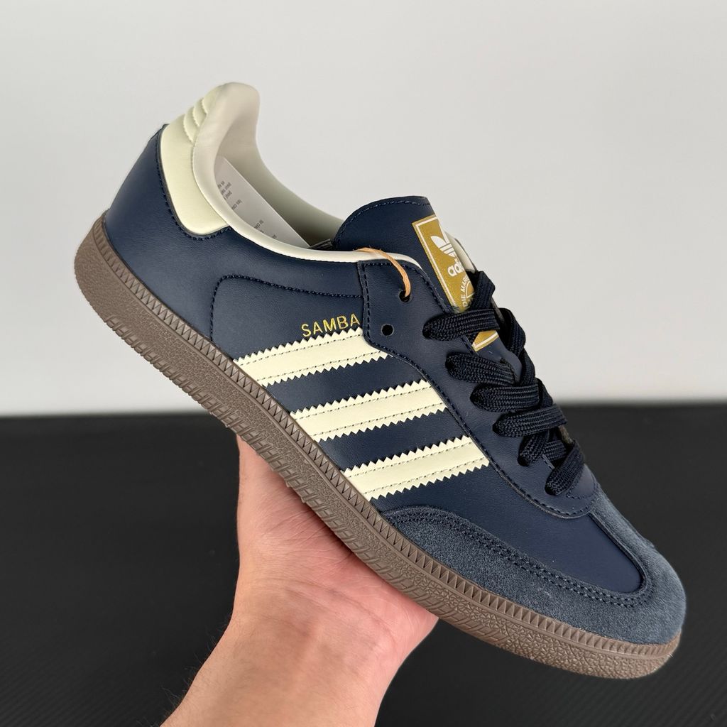 Side profile of adidas Samba OG Night Navy Gum sneaker ID2056, featuring deep navy leather, suede T-toe, cream white 3-stripes, and a gum rubber outsole. Available in Singapore and Malaysia..jpg