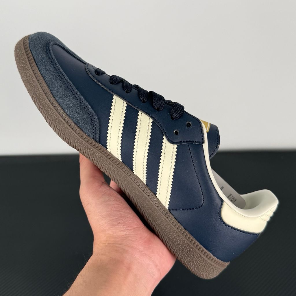 Side profile of adidas Samba OG Night Navy Gum sneaker ID2056, featuring deep navy leather, suede T-toe, cream white 3-stripes, and a gum rubber outsole. Available in Singapore and Malaysia..jpg