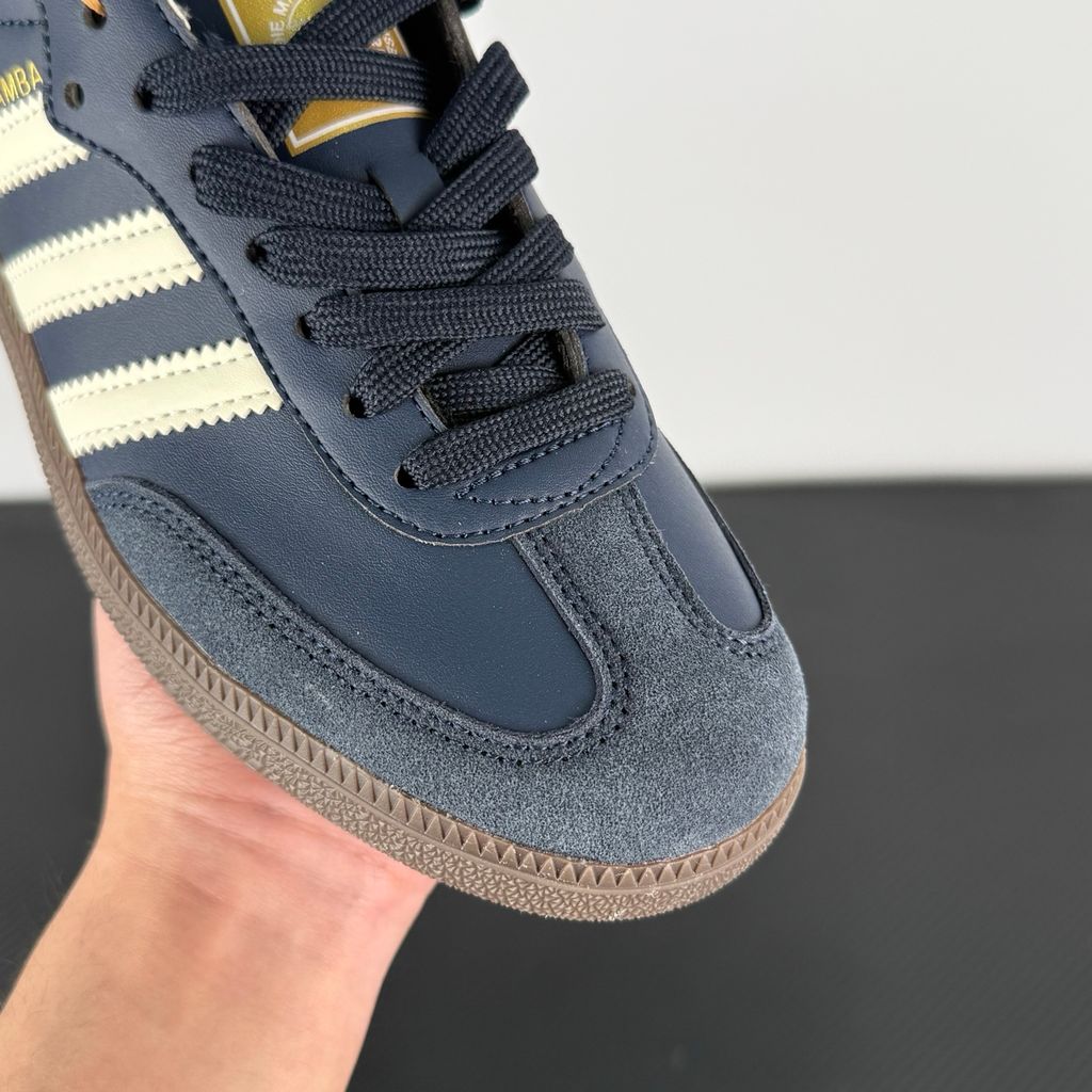 Side profile of adidas Samba OG Night Navy Gum sneaker ID2056, featuring deep navy leather, suede T-toe, cream white 3-stripes, and a gum rubber outsole. Available in Singapore and Malaysia..jpg