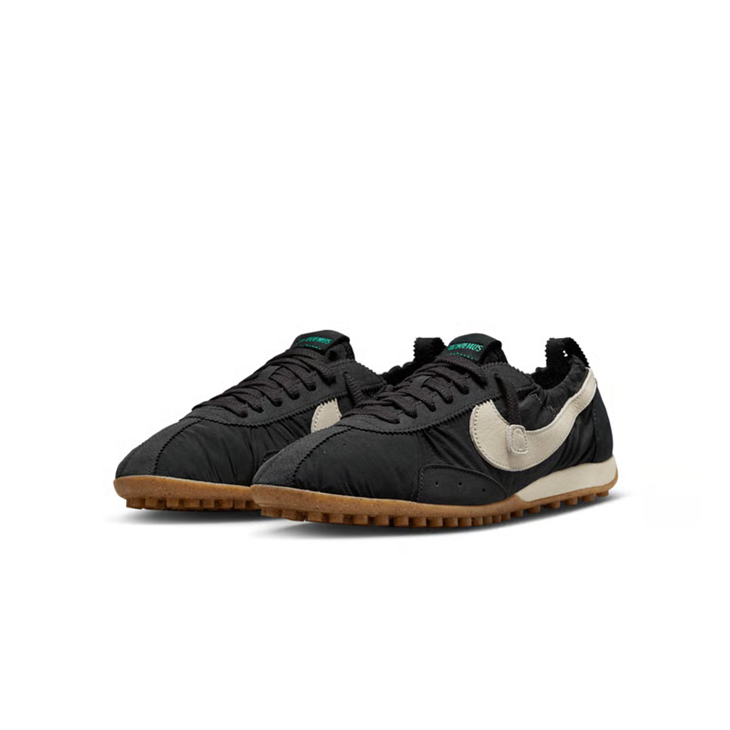 Side profile of Jacquemus x Nike Moon Shoe SP Off-Noir sneaker HV8547-001, featuring black ruched nylon, a leather Swoosh, and a gum rubber waffle sole. Available in Singapore and Malaysia.