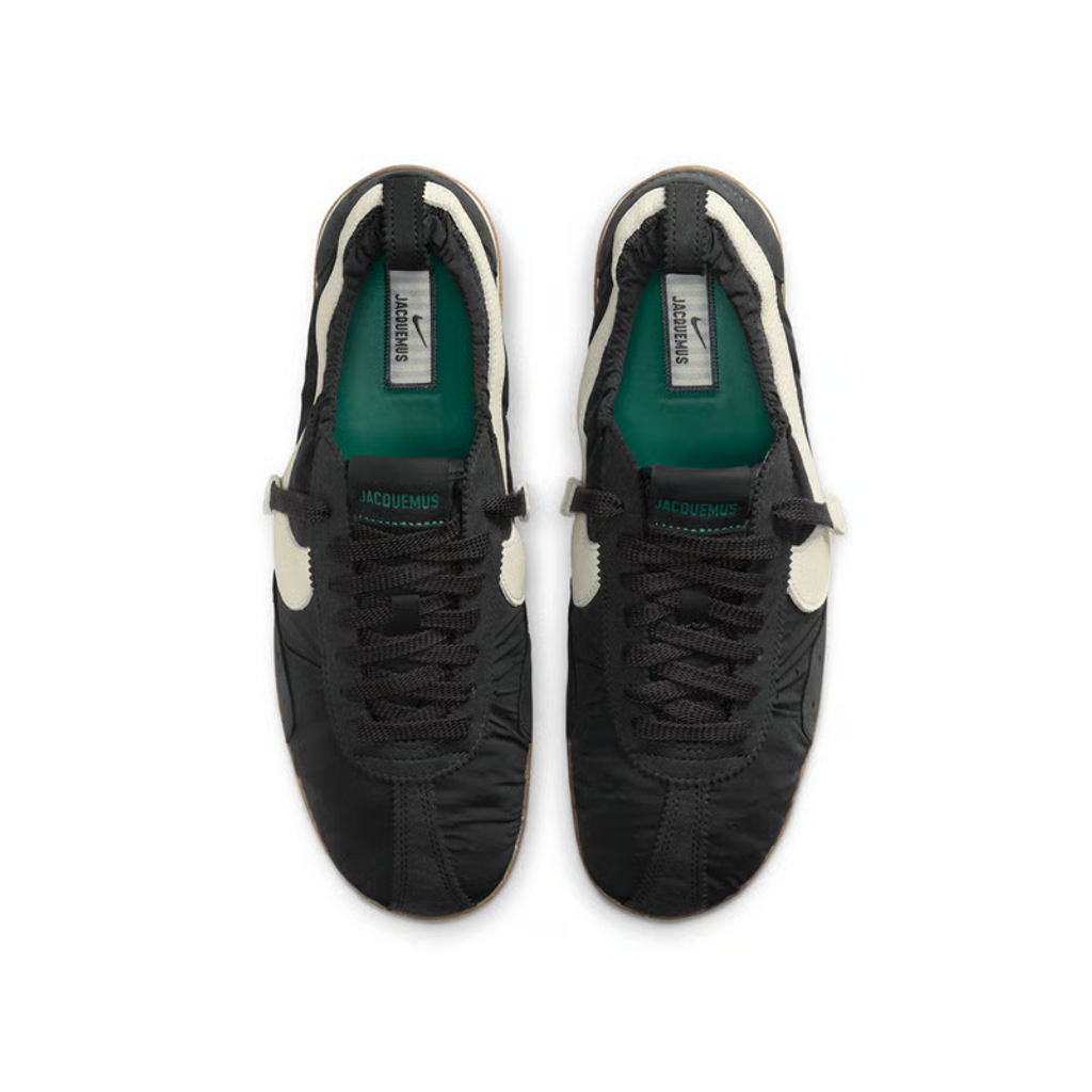 Side profile of Jacquemus x Nike Moon Shoe SP Off-Noir sneaker HV8547-001, featuring black ruched nylon, a leather Swoosh, and a gum rubber waffle sole. Available in Singapore and Malaysia.