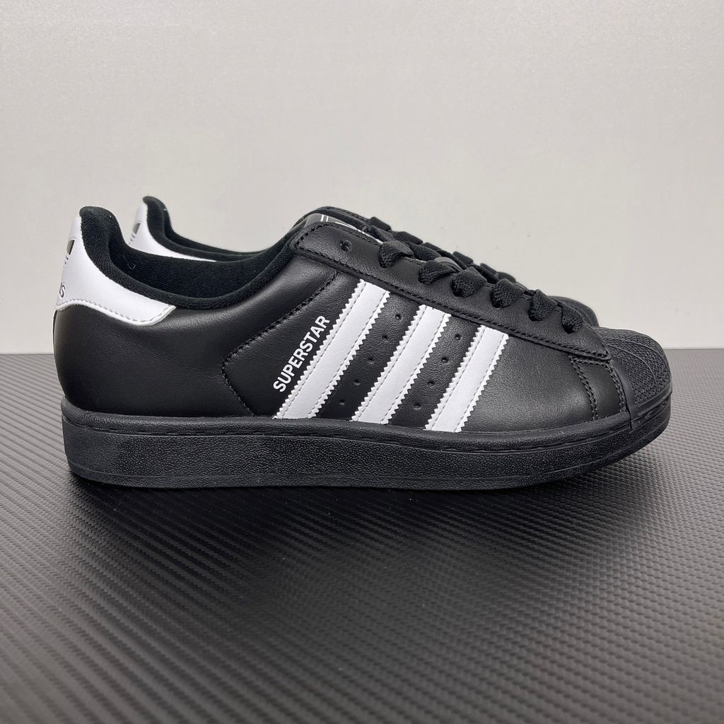 Side profile of adidas Superstar 2 Core Black Cloud White sneaker JI0079, featuring black leather, crisp white 3-stripes, and the legendary rubber shell toe. Available in Singapore and Malaysia.