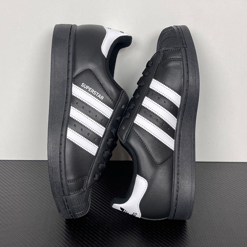 Side profile of adidas Superstar 2 Core Black Cloud White sneaker JI0079, featuring black leather, crisp white 3-stripes, and the legendary rubber shell toe. Available in Singapore and Malaysia.