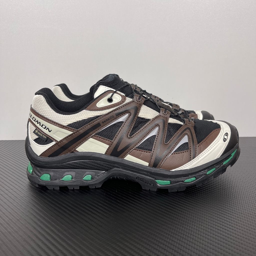 Side profile of Salomon XT-Quest GORE-TEX sneaker 491718 in Black Delicioso, featuring a waterproof dark mesh upper, Quicklace system, and rugged Contagrip outsole. Available in Singapore and Malaysia..jpg