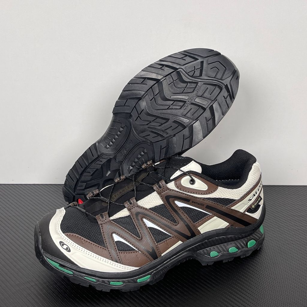 Side profile of Salomon XT-Quest GORE-TEX sneaker 491718 in Black Delicioso, featuring a waterproof dark mesh upper, Quicklace system, and rugged Contagrip outsole. Available in Singapore and Malaysia..jpg