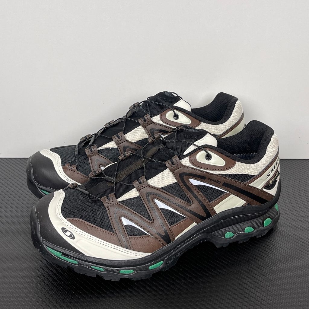 Side profile of Salomon XT-Quest GORE-TEX sneaker 491718 in Black Delicioso, featuring a waterproof dark mesh upper, Quicklace system, and rugged Contagrip outsole. Available in Singapore and Malaysia..jpg