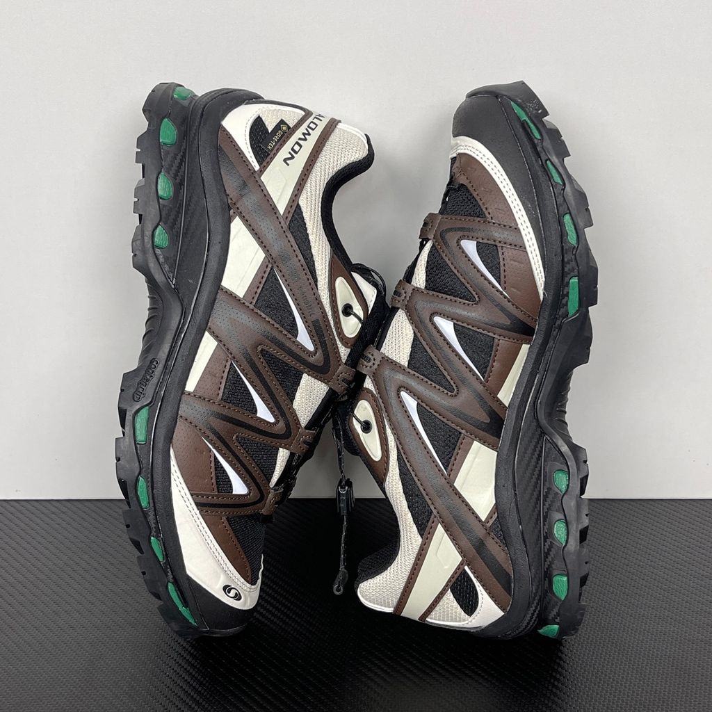 Side profile of Salomon XT-Quest GORE-TEX sneaker 491718 in Black Delicioso, featuring a waterproof dark mesh upper, Quicklace system, and rugged Contagrip outsole. Available in Singapore and Malaysia..jpg